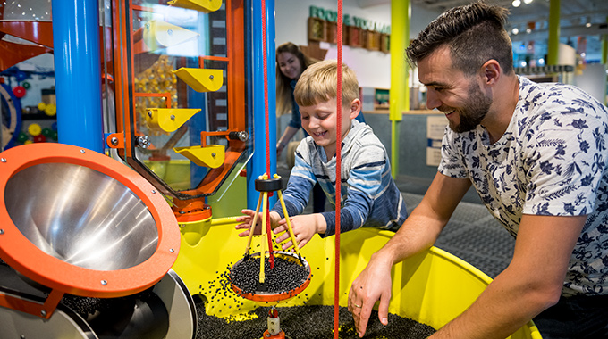 Boy and father playing with an exhibit at the Louisiana Children's Museum