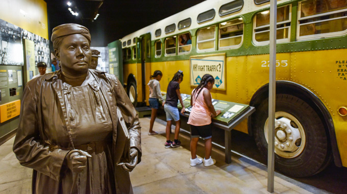 A statue of Rosa Parks beside a bus at the National Civil Rights Museum 
