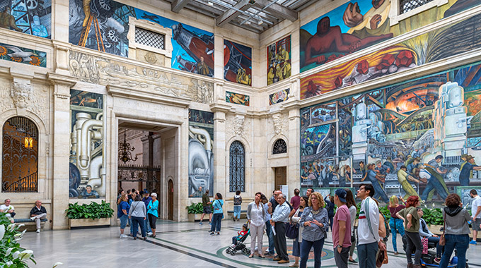 The Detroit Institute of Arts' skylit courtyard is surrounded by Diego Rivera’s bold celebration of local industry. | Photo by Ian G. Dagnall/Alamy Stock Photo