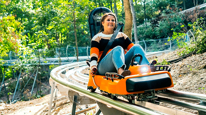 Woman riding Aerie's Alphine Coaster
