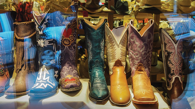 Cowboy boots displayed in the window at Wall Drug.