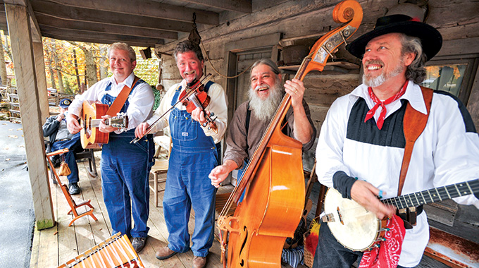 A quartet of musicians with various string instruments