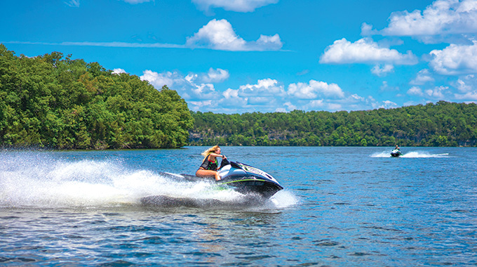 A woman riding a Jet Ski on the Lake of the Ozarks