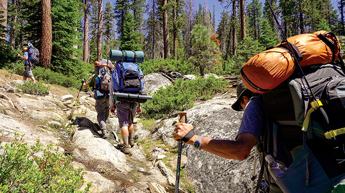 Hikers head up a slope in Yosemite National Park. | Photo by Eric Paul Zamora