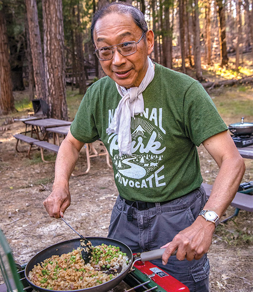 Leader Jack Shu cooks at a camp in Yosemite National Park.  | Photo by Eric Paul Zamora