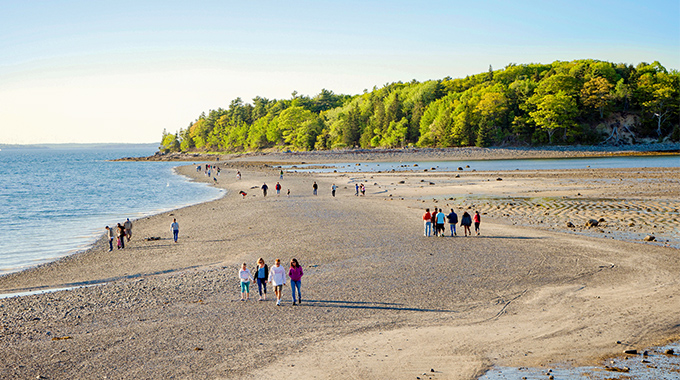 The receding tide reveals Bar Harbor’s namesake sand bar, which provides access to Bar Island when the water is low. | Photo by Cavan Images/Alamy Stock Photo