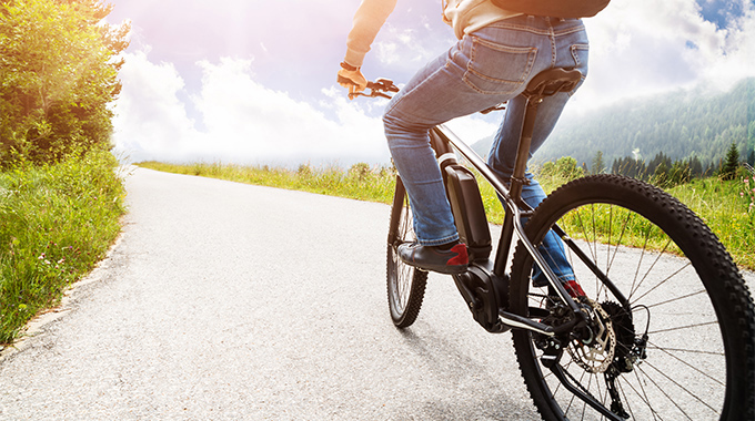 When exploring the park on two wheels, an electric bike can put some extra pep in your pedal. | Photo by Andrey Popov/stock.adobe.com