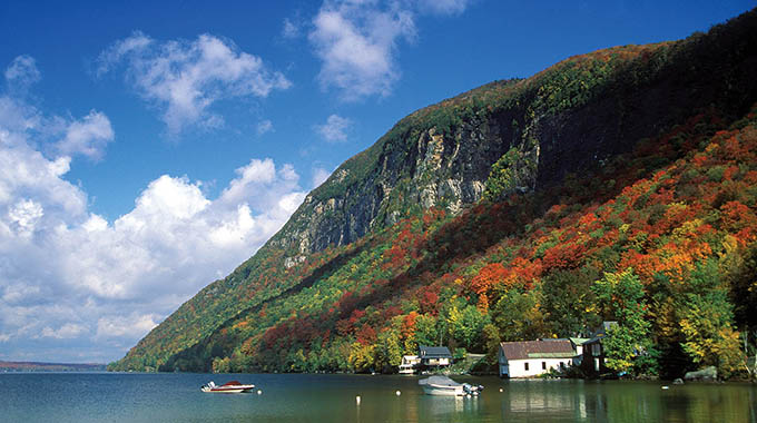 Mount Pisgah forms a dramatic backdrop to Lake Willoughby, Vermont. | Julie Mowbray / Alamy