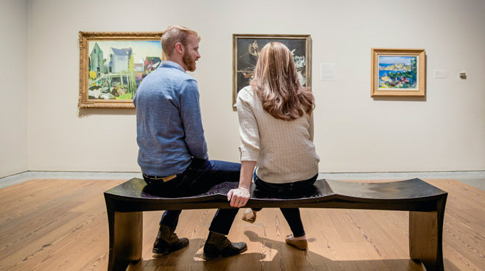 Couple sitting in an art museum