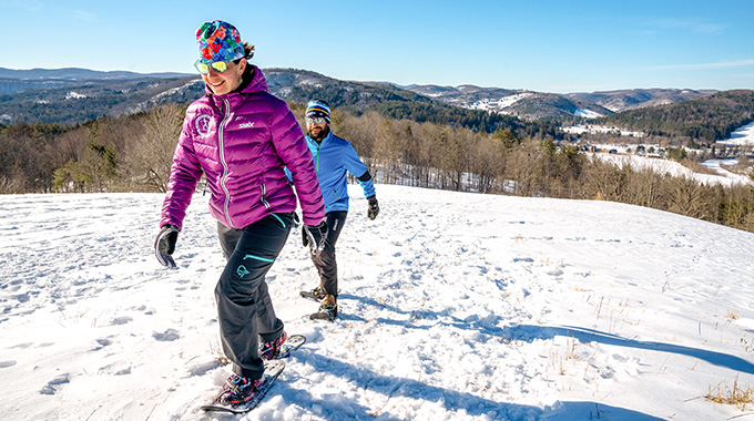 Guests at the plush Woodstock Inn and Resort will love taking a brisk, wintry hike on snowy trails that lead to Mount Peg’s summit. | Photo by Corey Hendrickson