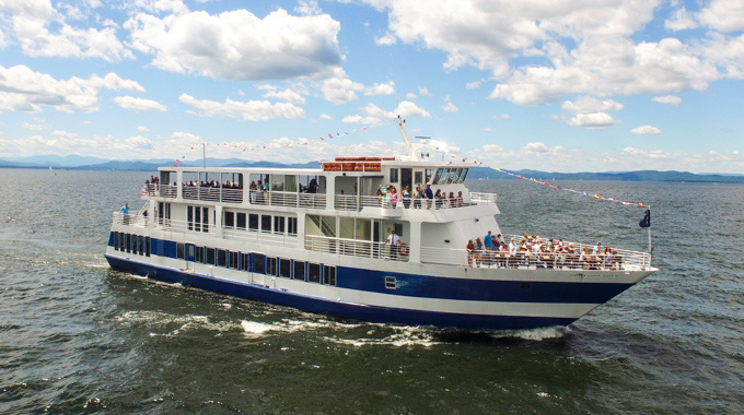 Passengers looking over the Spirit of Ethan Allen railing 