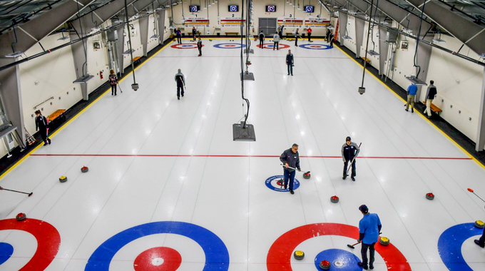 Members of the Merrimack Valley Curling Club playing