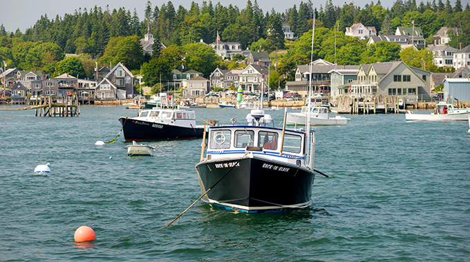 Lobster boats are moored in Deer Isle's Stonington Harbor. | Photo by D. Trozzo/Alamy Stock Photo