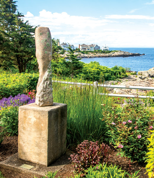 Breaching Whale sculpture, with Perkins Cove in the distance.