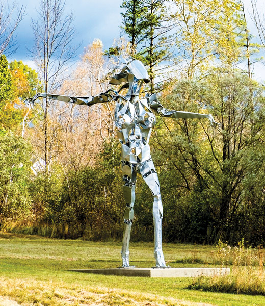 The Muse, a giant metal humanlike sculpture.