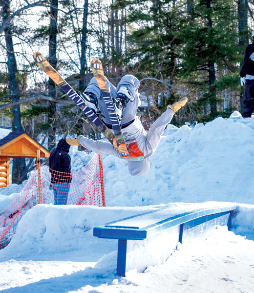 Skier doing a flip during the rail jam.