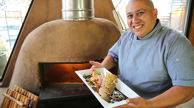 Executive Chef Ray Naranjo in front of the horno. | Photo courtesy Indian Pueblo Cultural Center