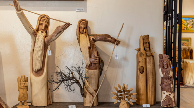 Wooden sculptures inside Chimayo Trading Del Norte.