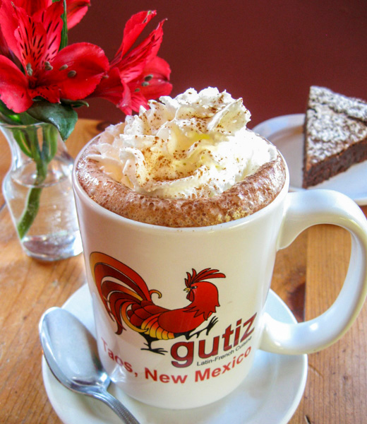 Mexican hot chocolate topped with whipped cream and served in a Gutiz mug
