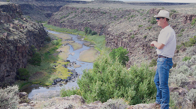 Shane Henry surveys the Rio Grande gorge. He spends about 10 months a year on the road.
