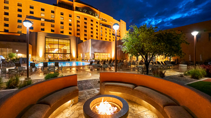 An outdoor firepit at Sandia Resort in the evening.