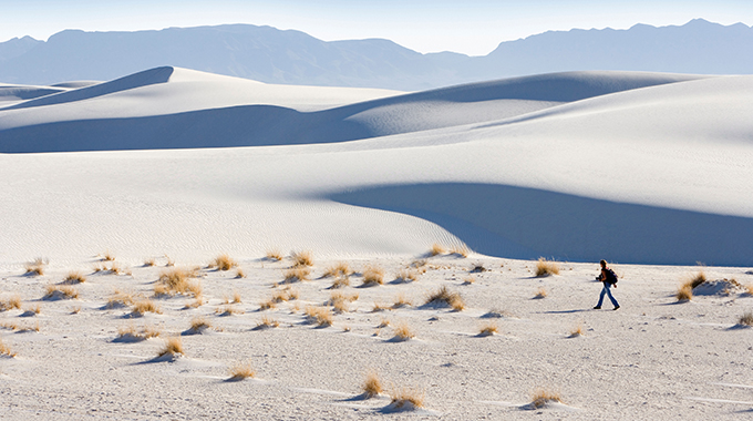 A solitary hike through the dunes at White Sands National Monument. | Photo by B.A.E. Inc./Alamy Stock Photo