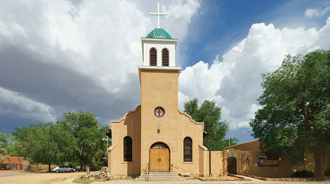 While the St. Joseph Catholic Church in Cerrillos is only open to the public for mass, visitors can still wander through the courtyard garden in the back. | Photo by Steve Larese