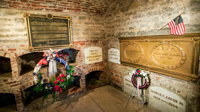 William Henry Harrison's tomb, decorated with a flag and wreaths.