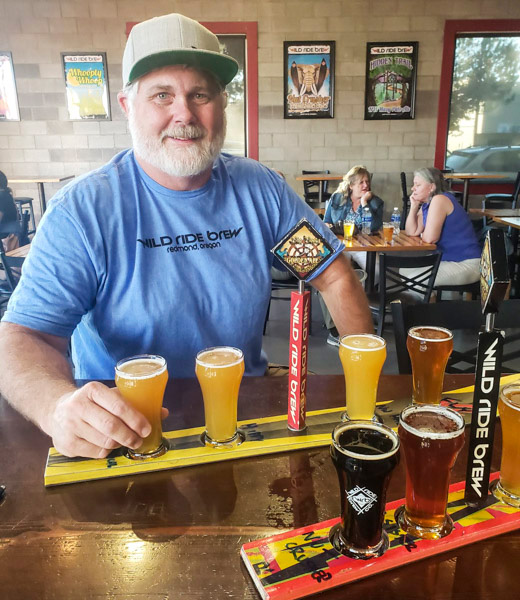 Michael White with a flight of beers at Wild Ride Brewing