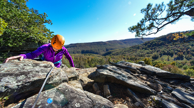 Person rock climbing at Horseshoe Canyon Ranch.