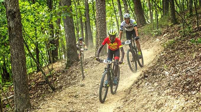 Mountain bikers maneuvering a trail in Lake Leatherwood City Park.