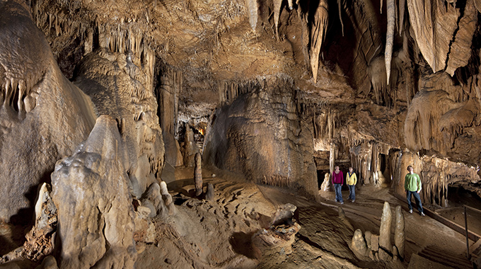 Visitors looking up at the formations inside Marengo Cave.