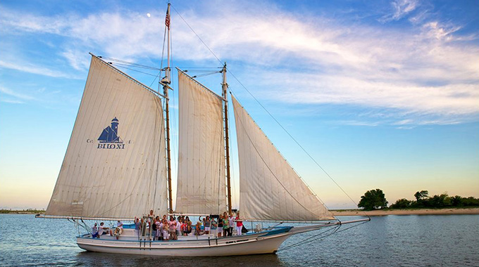 People aboard an oyster schooner.