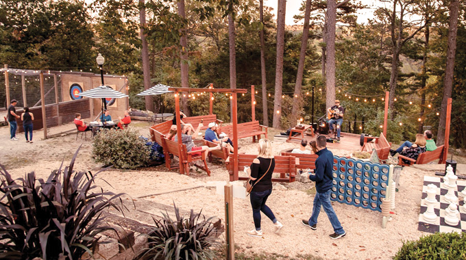 Enjoy live music and activities like giant chess and hatchet-throwing at the 1886 Crescent Hotel & Spa’s Frisco Sporting Club. | Photo courtesy 1886 Crescent Hotel & Spa