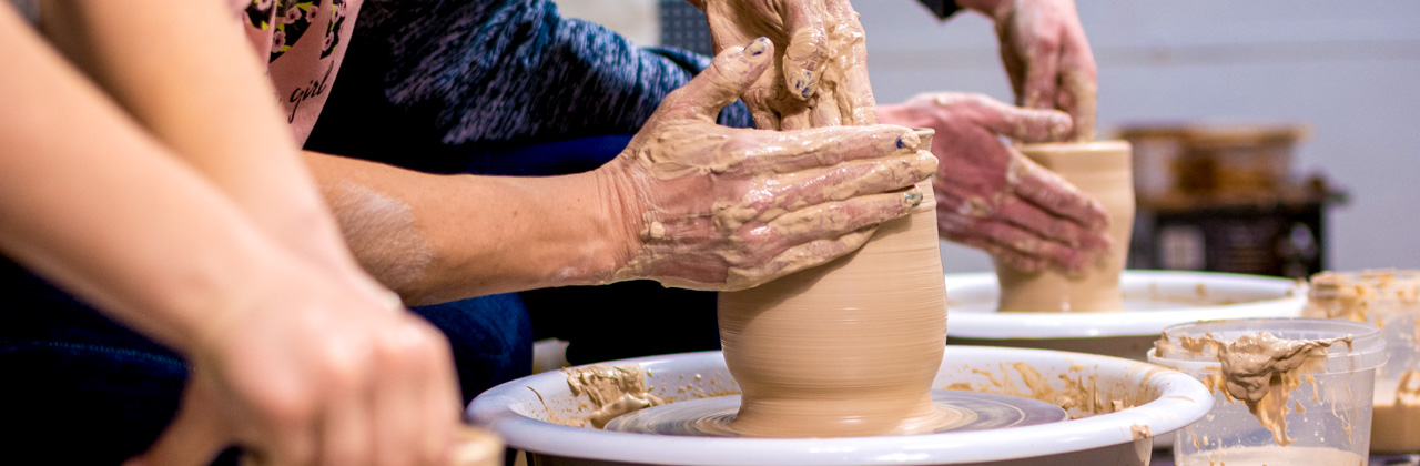 Master class on modeling of clay on a potter's wheel In the pottery workshop. High quality photo
