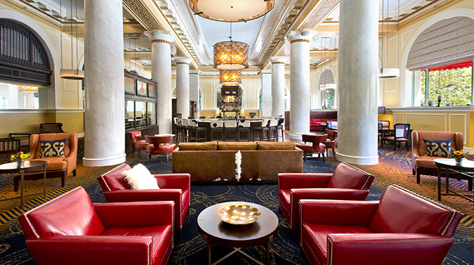 Formerly a bank building, Houston’s boutique Hotel ICON boasts marble bathrooms, vintage archways, and 30-foot columns in the lobby. | Photo courtesy Autograph Collection Hotels