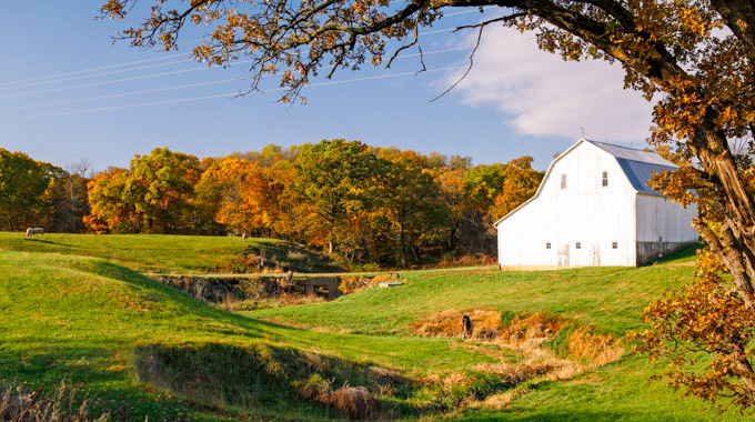 A barn perched upon rolling hills in the Glacial Hills Scenic Byway.