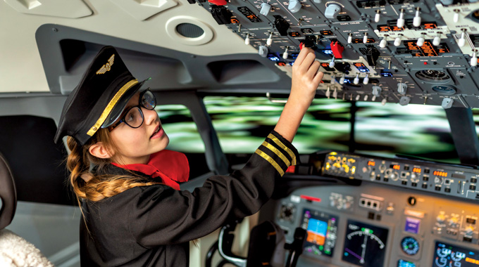 KidZania visitor learning about a career as a pilot.
