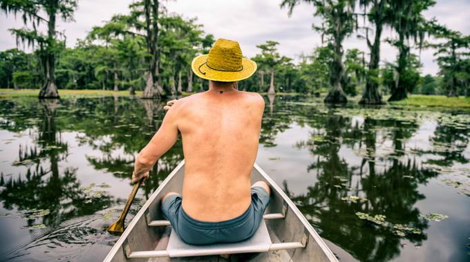Man paddling on Caddo Lake