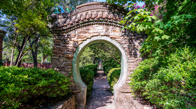 A brick archway in Chandor Gardens