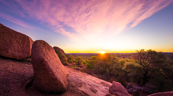 Watch the sunset with your sweetheart at the Enchanted Rock State Natural Area. | Photo by Adobe Stock Photo