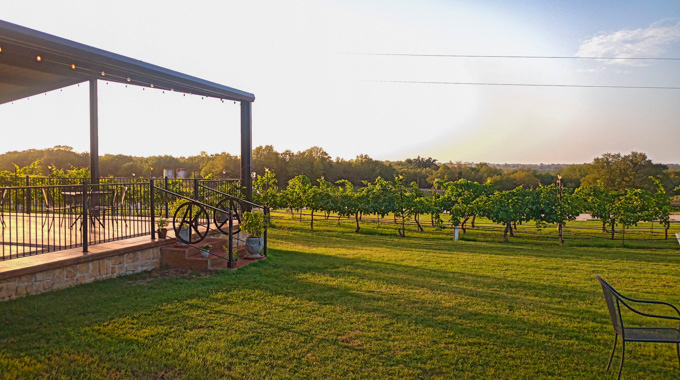 The patio at Arché winery overlooks the vineyards and rolling hills in the Red River Valley. | Photo by Grayson Davies