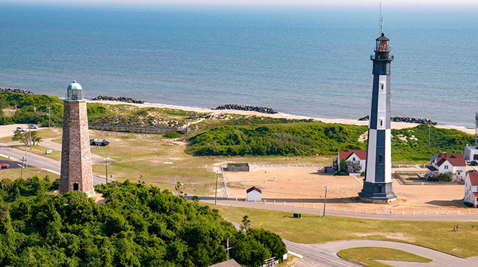 The federal funding for the original Cape Henry Lighthouse (left) was authorized by George Washington and overseen by Alexander Hamilton. | Photo by RosaIreneBetancourt 12/Alamy Stock Photo