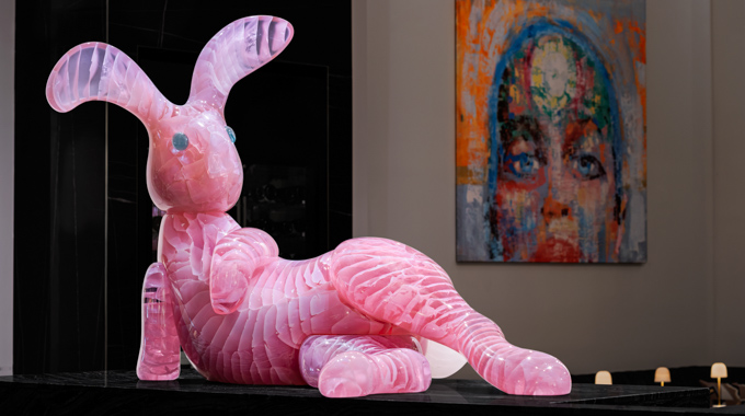 A pink glass bunny on display