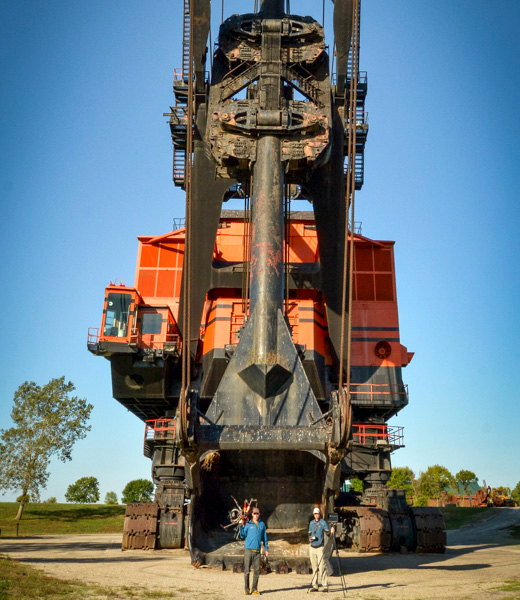 Two people standing in front of Big Brutus