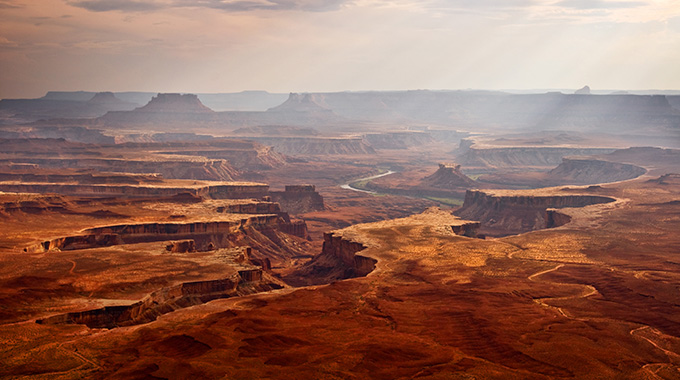 A dramatic, chiseled landscape awaits Canyonlands National Park visitors.