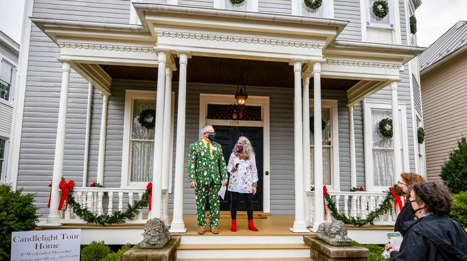 Festively dressed hosts await guests during the Fredericksburg Holiday Candlelight Tour