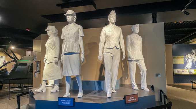 Statues of women in various Army uniforms.