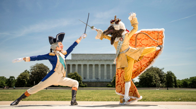 Dancers dressed as a nutcracker George Washington and King George III Rat King duel.