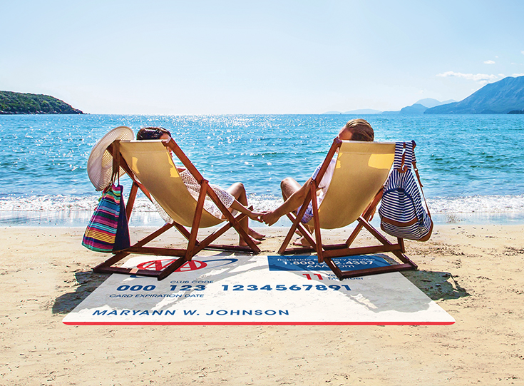 Couple holding hands while sitting in chairs on the beach Couple holding hands while sitting in chairs on the beach